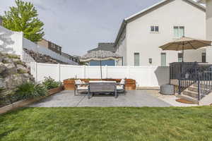 View of yard featuring a patio area and an outdoor hangout area