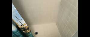 Basement-Bathroom view of curtained shower