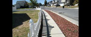 Sir Timothy View of asphalt street with sidewalks, a residential view, and curbs