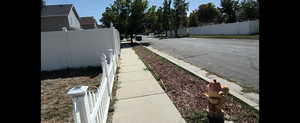 Sir Michael Drive View of asphalt road featuring sidewalks