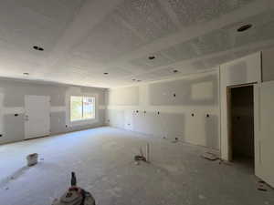 Unfurnished room featuring a textured ceiling