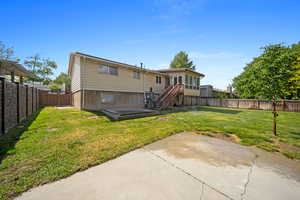 Rear view of property featuring a patio