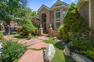 View of front facade featuring brick siding