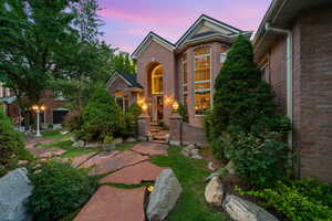 View of front of house with brick siding