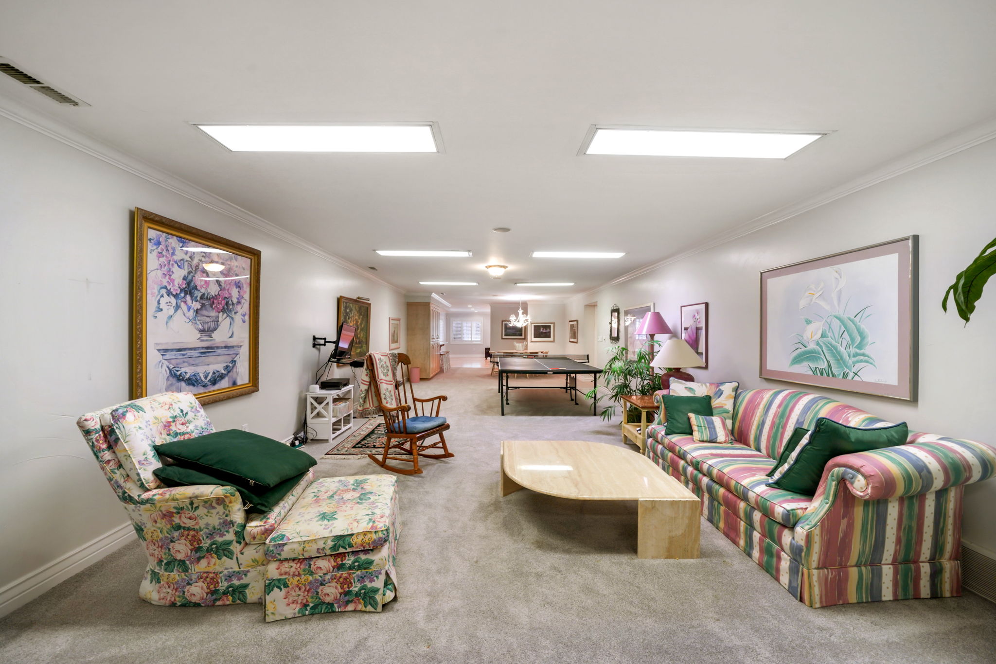 Living room with carpet and crown molding