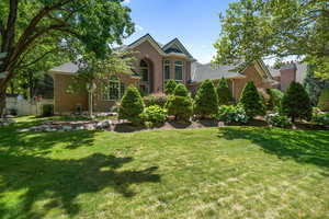 Traditional home featuring brick siding
