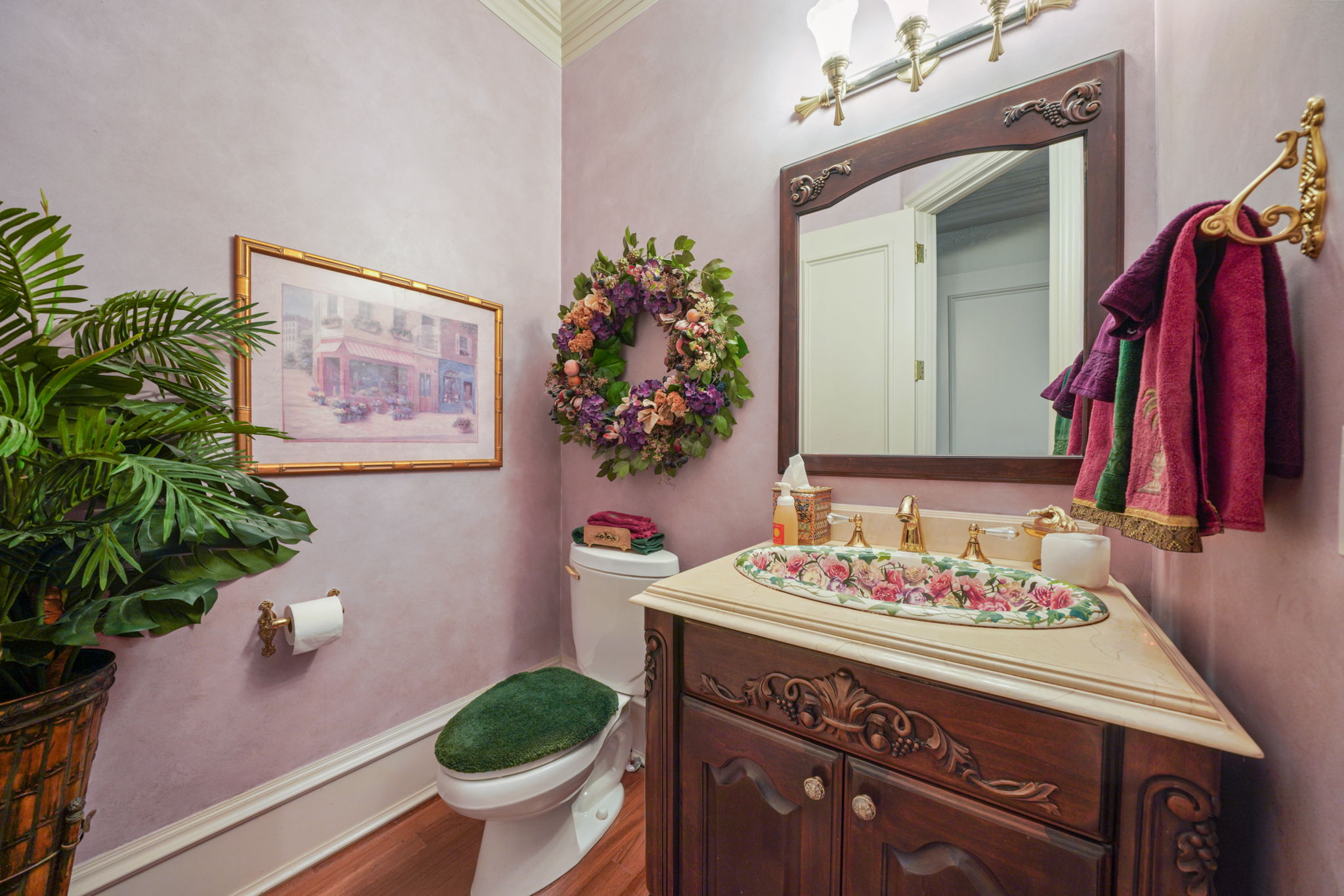 Bathroom with vanity, wood finished floors, and crown molding