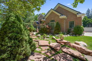 View of front of house with brick siding