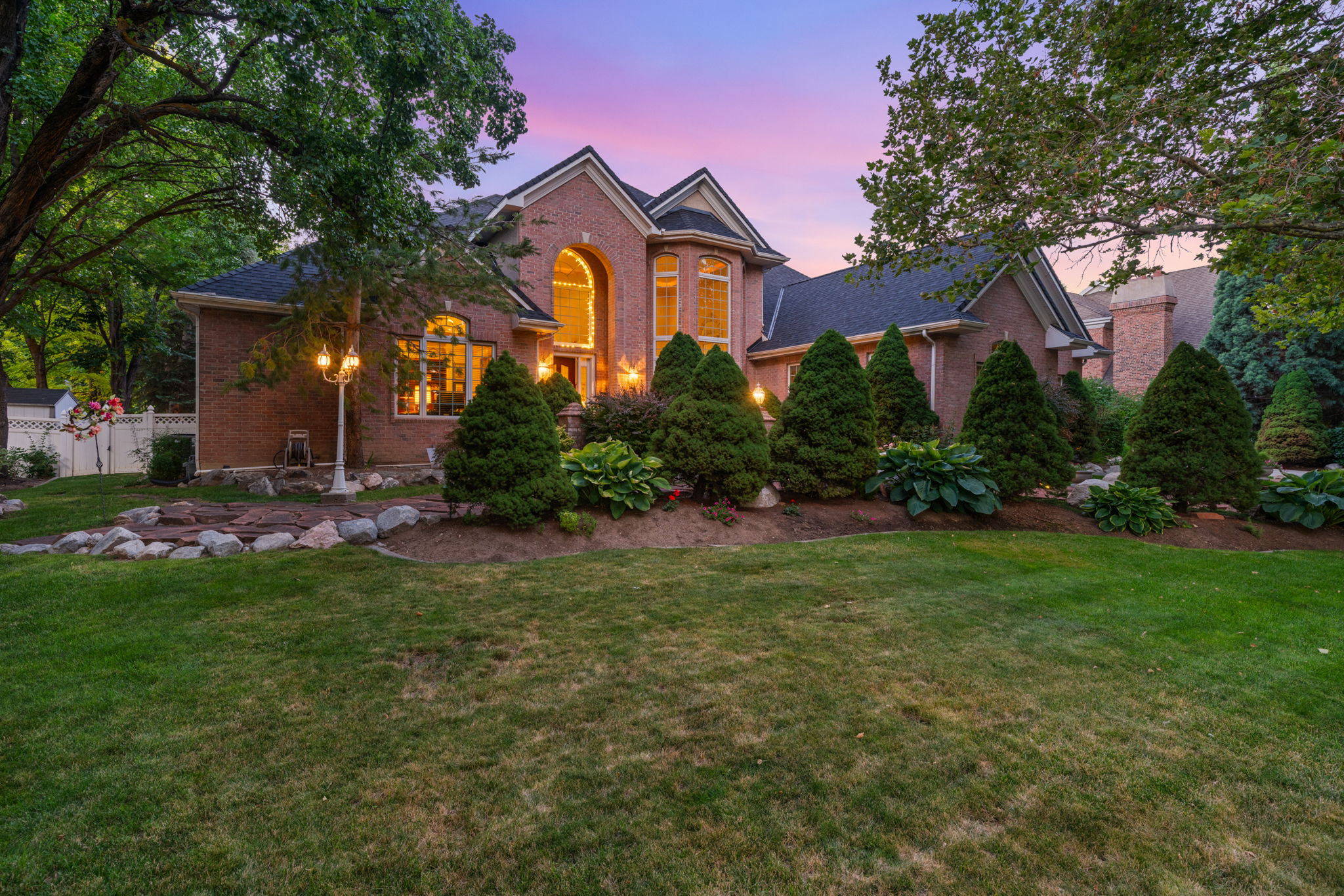 Traditional-style home featuring brick siding