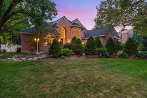 Traditional-style home featuring brick siding