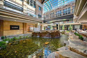 View of property's community with a small pond