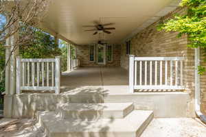 View of covered patio / terrace with a ceiling fan