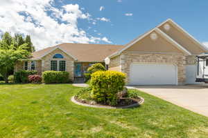 Ranch-style home with a front lawn, an oversized 3 car attached garage, brick siding, concrete driveway, and a shingled roof