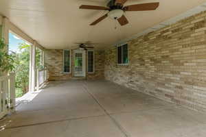 View of covered patio with ceiling fan