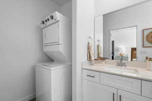 Laundry room with estacked washer and dryer