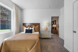 Bedroom with carpet and baseboards