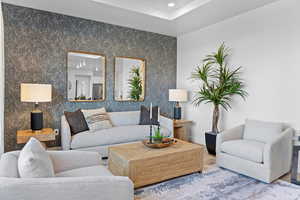 Living area featuring recessed lighting and baseboards