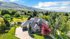 View from above of property with a mountain backdrop