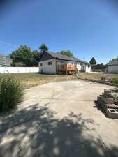 Rear view of property featuring a wooden deck