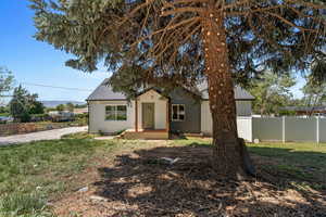 Bungalow-style home featuring a shingled roof