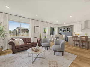 Living room featuring recessed lighting and light wood-type flooring