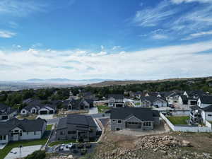 Aerial view of residential area featuring a mountainous background