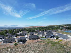 Aerial perspective of suburban area featuring a mountainous background