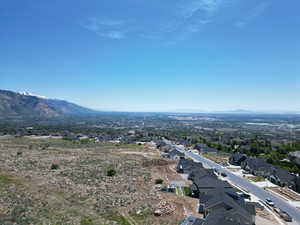 Aerial view of residential area featuring mountains
