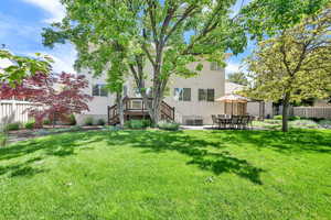 Rear view of property with stucco siding and a patio area