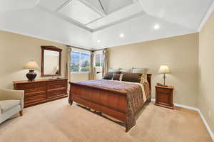 Spacious Master Bedroom with light carpet, recessed lighting, crown molding, and sitting area