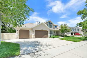 Attached, oversized 3-car garage.  RV parking on the South side of the garage.