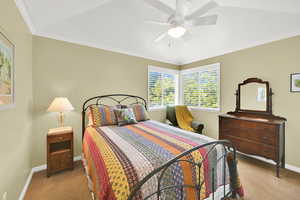 4th second-floor Bedroom featuring carpet, baseboards, ceiling fan, and ornamental molding