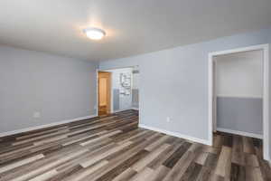 Open living area with newer flooring throughout