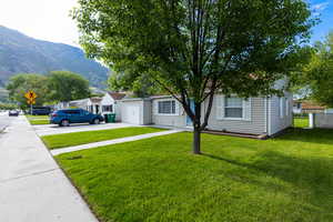 View of front yard with a mountain views and hiking trails right outside your front door!