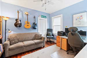 Office space with ceiling fan and wood finished floors