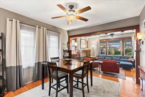Dining room with a ceiling fan and light wood-style floors