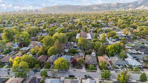 Aerial perspective of suburban area with a mountain backdrop
