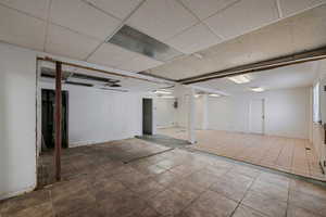 Finished basement with a drop ceiling