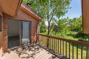Deck featuring a lawn