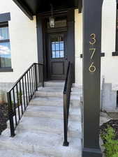 Doorway to property with brick siding