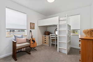 Main floor bedroom #2 with large windows