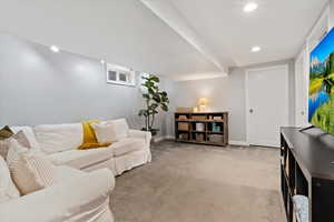 Lower level family room with recessed lighting.