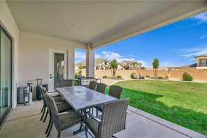 View of patio / terrace with outdoor dining space and a residential view