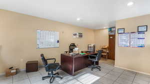 Office area with baseboards, light tile patterned floors, and recessed lighting
