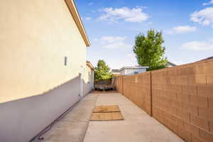 View of home's exterior featuring a fenced backyard, a patio area, and stucco siding