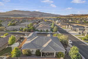 Aerial perspective of suburban area featuring a mountainous background
