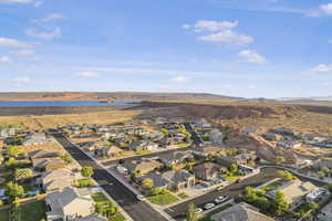 Aerial view of property's location featuring nearby suburban area and a water and mountain view
