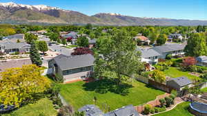 Aerial view of residential area featuring a mountainous background