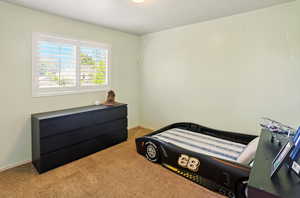 View of carpeted bedroom