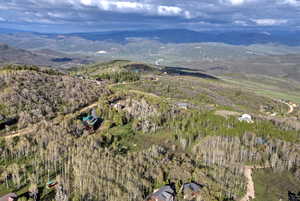 Aerial overview of property's location with a mountain backdrop